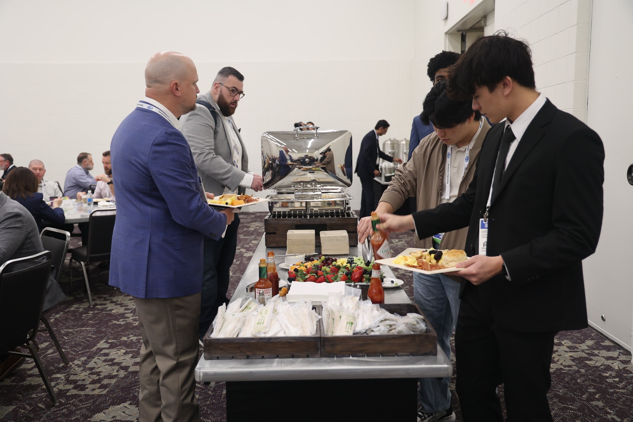 Students and professionals at the breakfast buffet