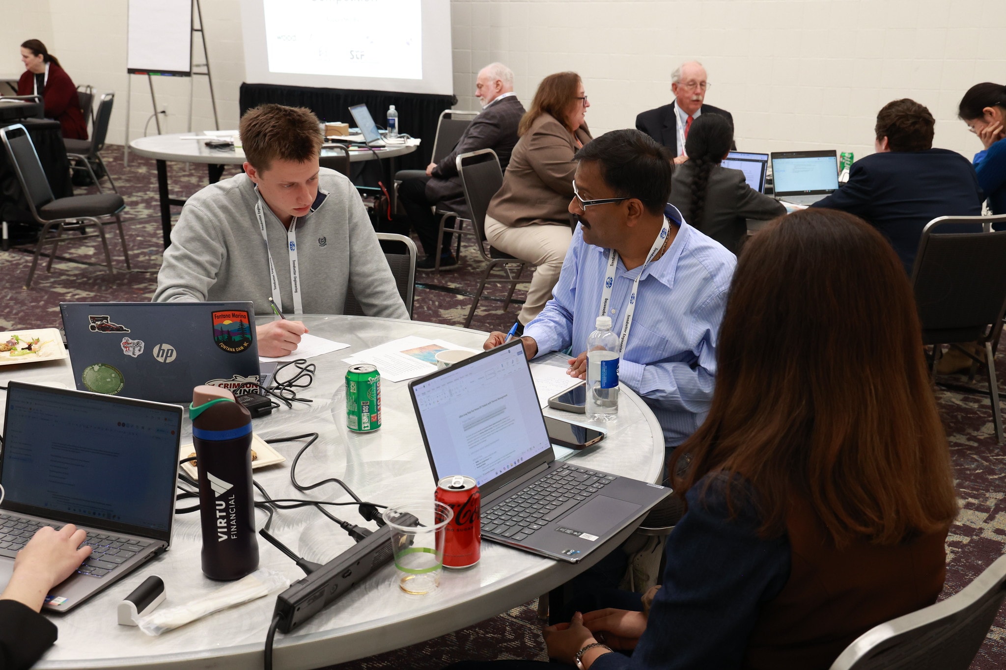 Students working with industry mentors during the competition